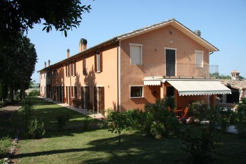 an exterior view of a house with a yard at Country House Montesoffio in Barchi