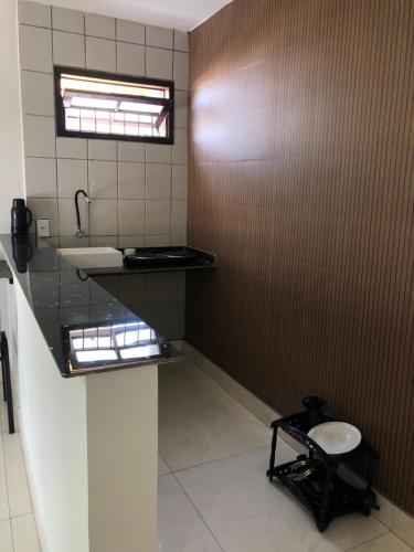 a bathroom with a sink and a toilet at Residencial santiago in Porto Seguro