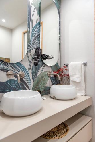 a bathroom with a sink and a mirror at Napoli Suite Station in Naples