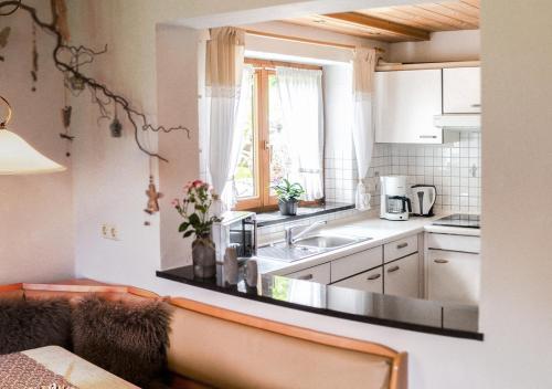 a kitchen with a sink and a counter top at Ferienwohnung Jochum-Pfeiffer in Riezlern