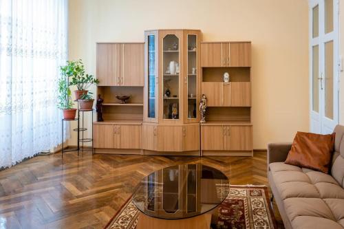 a living room with a large wooden cabinet at casa max in Timişoara