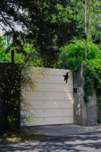 a white garage door with bats on top of it at El Carmelo Mountain Lodge in Potrerillos