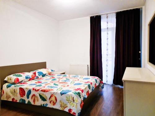 מיטה או מיטות בחדר ב-GardenView Apartment
