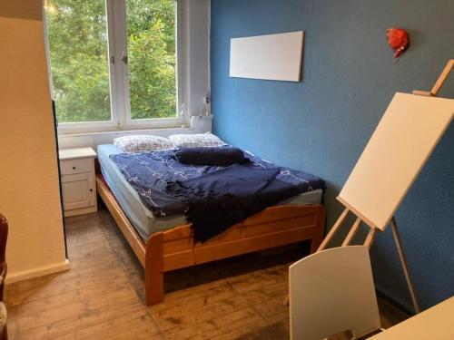 a bedroom with a bed in a room with a window at Ferienhaus Sommer Linden in Deyelsdorf