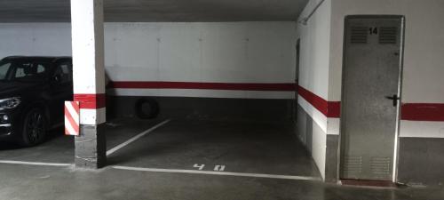a garage with a car parked inside of it at EL RINCÓN DEL GUADALQUIVIR in La Rinconada
