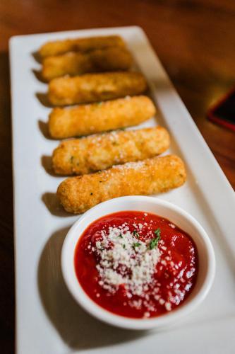 a plate of food with sauce on a table at Clarion Hotel BWI Airport Arundel Mills in Hanover