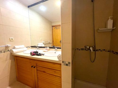 a bathroom with a sink and a shower at Tenerifeopenhome Club Paraiso in Adeje