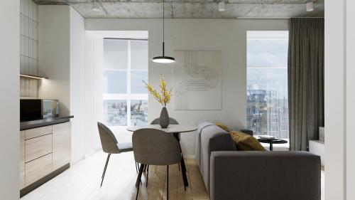 a kitchen and living room with a table and chairs at Апартаменти-студія, дизайнерський ремонт, ЦЕНТР, біля Либідь Плаза in Khmelʼnytsʼkyy