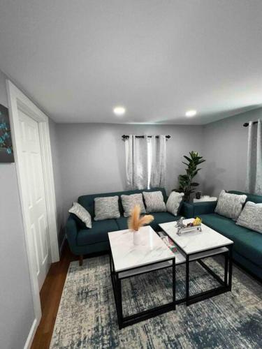 a living room with a couch and a table at Two Bedroom Apartment on Forestville Bristol in Bristol