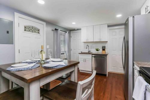 a kitchen with a wooden table and a refrigerator at Two Bedroom Apartment on Forestville Bristol in Bristol