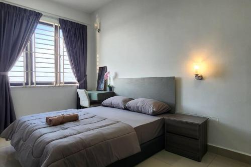 a bedroom with a large bed and a large window at JC Sky Riverfront 'Nebula' in Kota Bharu