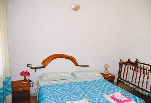 Een bed of bedden in een kamer bij B&B i Bonsai Talana