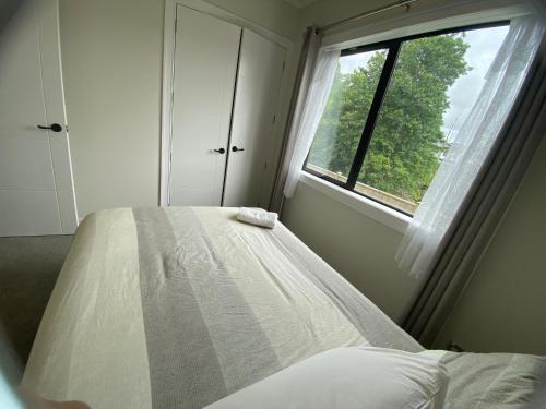 Postel nebo postele na pokoji v ubytování Auckland GQ Flat bush holiday home