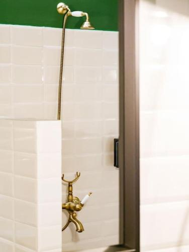 a shower in a bathroom with a faucet at vaya_living in Ktistádes