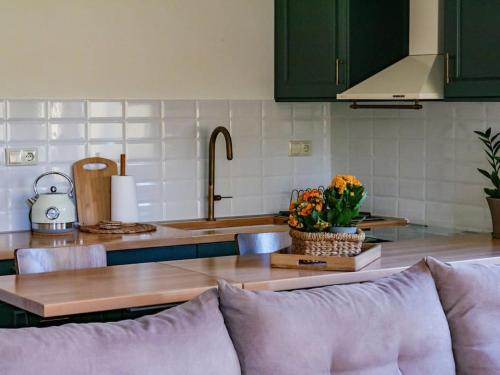 a kitchen with a couch in front of a counter at vaya_living in Ktistádes