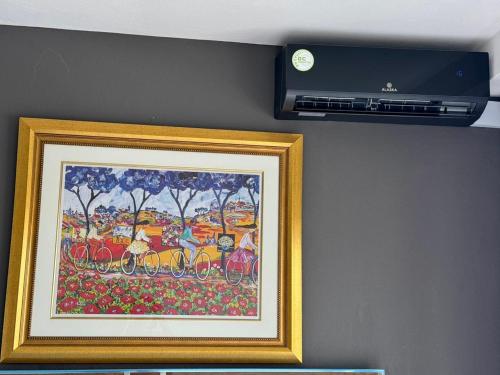 a picture of a painting of a train on a wall at D&DLuxury Rivonia Apartments with inverter in Johannesburg