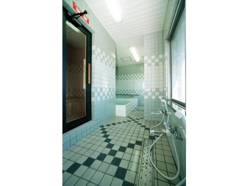 a bathroom with a shower and a tub and a sink at Business Green Hotel Hino - Vacation STAY 16322v in Hino