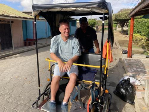 a man is sitting in a golf cart at Hostel Julieta in Rivas
