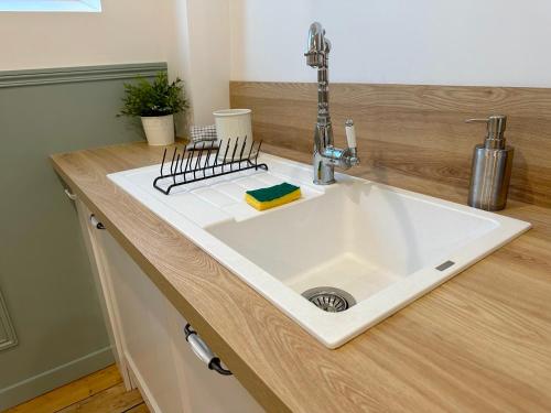 a kitchen counter with a sink in a kitchen at ღ Fabrik • Parking sécurisé & Wifi fibre in Douai