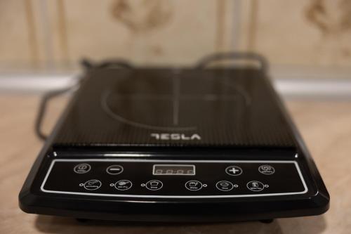 a black cell phone sitting on a table at Hotel Muška voda in Kladanj