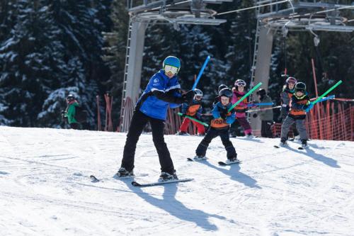 a group of people skiing on a ski lift at Ninis - Ferienhaus im Bregenzerwald in Egg
