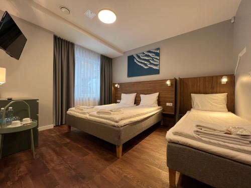 Letto o letti in una camera di Stay Vilnius Hotel