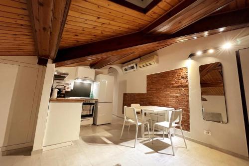 a kitchen and dining room with a table and chairs at The Perfect Base to Explore Tuscany - Between Pisa, Lucca, and Florence! - Netflix & YouTube Premium Included in Montecatini Terme