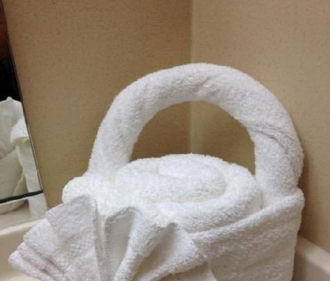 a roll of white towels sitting on top of a sink at اريس الشرق للشقق ا لمخدومة in Jeddah