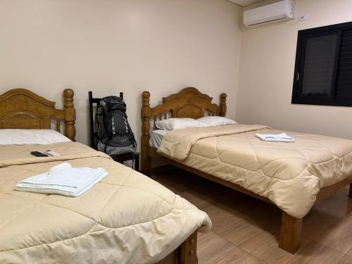מיטה או מיטות בחדר ב-HOTEL E RESTAURANTE NA CHÁCARA