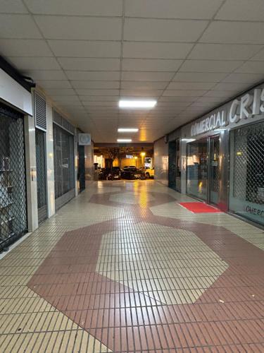 an empty hallway of a building with a tiled floor at Pensión La Castellana in Logroño