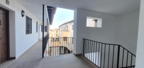 an empty hallway of a house with a balcony at Balcon del Calar 27, Guejar Sierra in Güéjar-Sierra