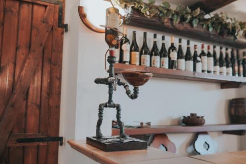 a wine machine on a counter in a room with wine bottles at IL Sole in Caselle Torinese