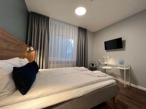 Letto o letti in una camera di Stay Vilnius Hotel