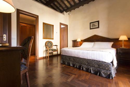 Una cama o camas en una habitación de Hotel Teatro Pace