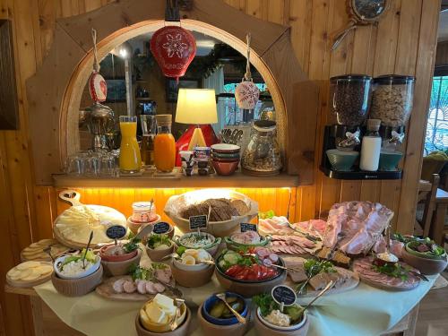 a buffet of food on a table in a room at Marina Zakopane in Zakopane