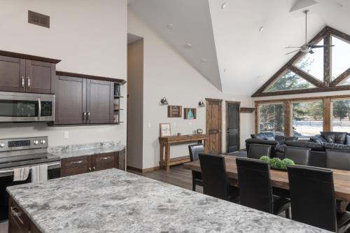 a kitchen and living room with a table at Summit View in Valemount