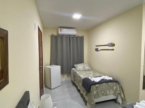 Cama o camas de una habitación en Pousada Canoa dos Anjos suítes