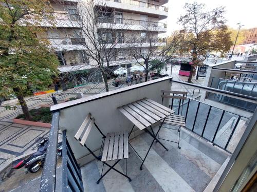 a balcony with a bench and a table and a motorcycle at Lisbon`s best at Campo Pequeno in Lisbon