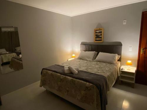 Cama o camas de una habitación en Pousada Canoa dos Anjos suítes