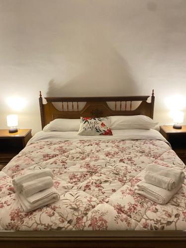 a bedroom with a bed with two towels on it at CASA VACANZE Da Mario Lu Ciclista in Spello