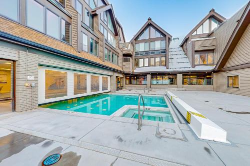 an exterior view of a house with a swimming pool at Park City Charmer in Park City