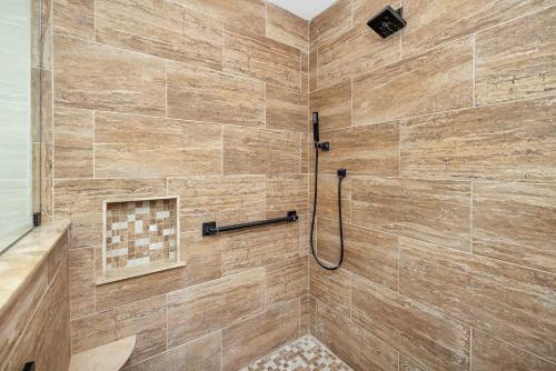 a bathroom with a shower with a tile shower at Privacy Please! in Saint Simons Island