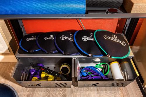 a drawer filled with ping pong balls and other items at Hilton Anatole in Dallas