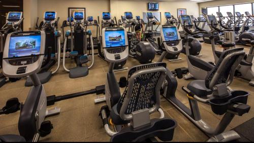 a gym with a bunch of cardio machines at Hilton Anatole in Dallas