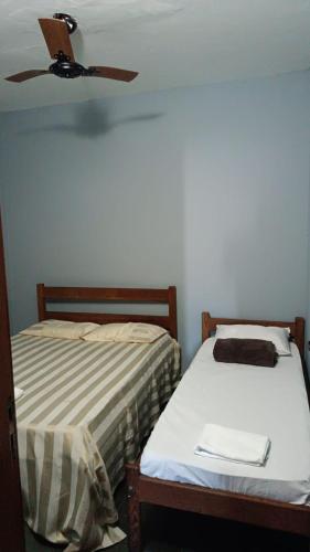 Ένα ή περισσότερα κρεβάτια σε δωμάτιο στο Hostel Diniz II