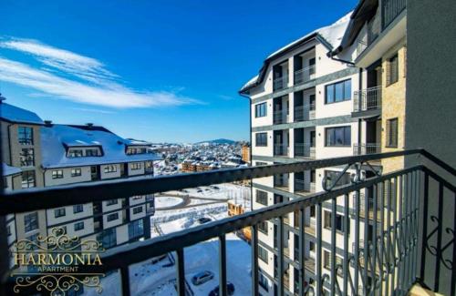 a balcony with a view of a city at Dunja lux in Zlatibor