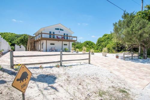 a house with a camel sign in front of it at Bright New Beach House with In- Law Suite -- 2 blocks to beach! in Saint Augustine