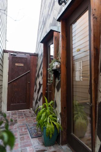an entrance to a house with a door and plants at The Rosemary in Los Angeles