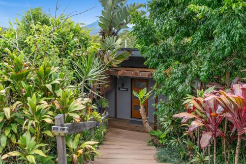 a house with a wooden walkway leading to a front door at La Rochér Eco Retreat in Stokers Siding