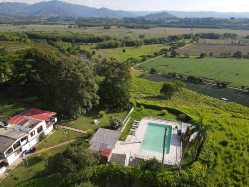 an aerial view of an estate with a swimming pool at Finca Maratón Alto in Calarcá
